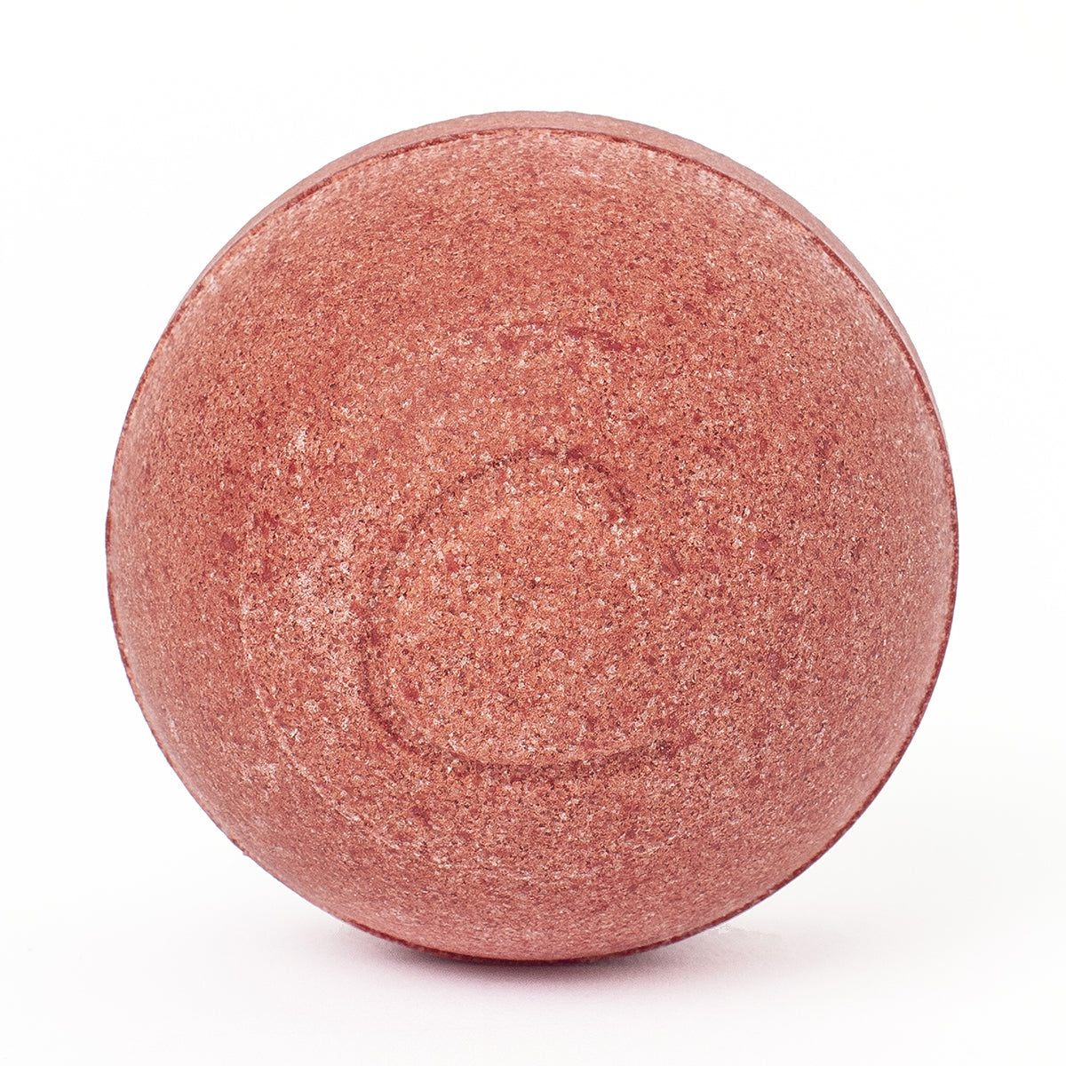 Round, textured hibiscus-red bath bomb isolated on a clean white background.